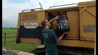 Cat 215B Excavator cleaning up scrap