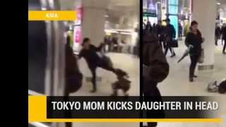 Japanese mother kicks daugher in the head at Shibuya Station, Tokyo