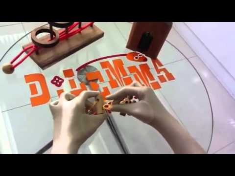 RING AND STRING,TWIN PUZZLE SOLUTION BY DILEMMA GAMES