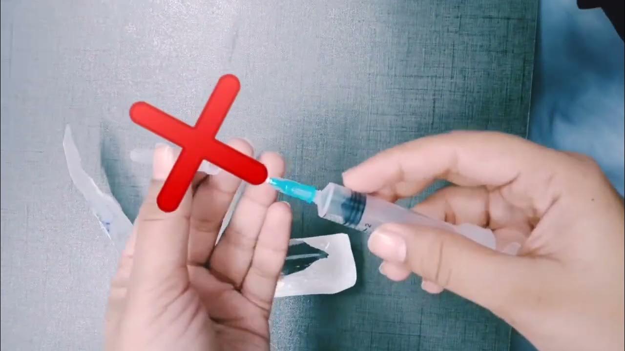 how to recap a needle with scoop technique. nurse using syringes. The