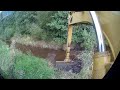 Разрушение плотины экскаватором CAT 312