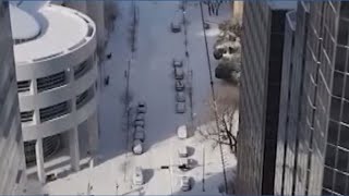 Drone video shows a snow-covered Oklahoma City as 8 inches of snow fell from the winter storm