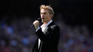 Cody Simpson performs the Australian National Anthem at the Melbourne Game