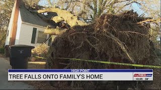Strong storms Sunday evening caused a tree to fall on top of a home in High Point