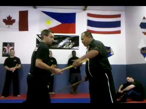 Grand Master Bobby Taboada demonstrating a disarm ...