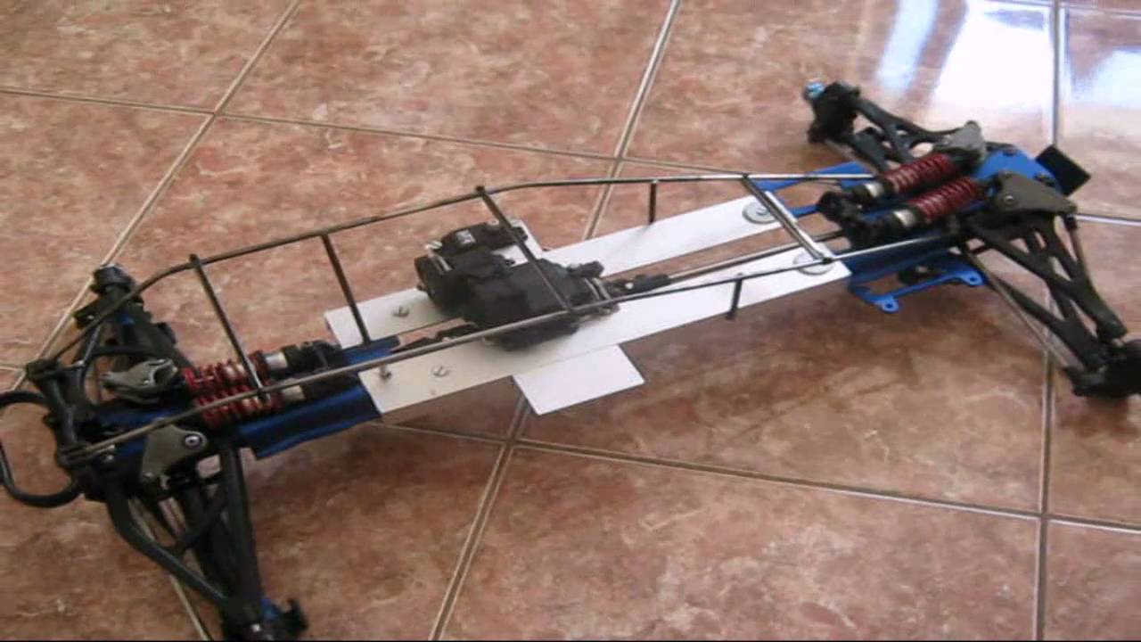 Homemade rc car with revo parts and baja style roll cage.