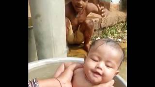 Baby Bathing In Tubewell In Village