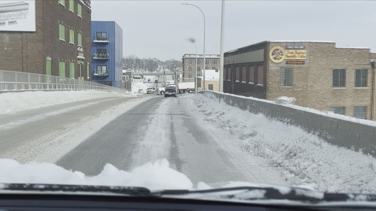 Plows battle icy conditions at intersections and over bridges in ...