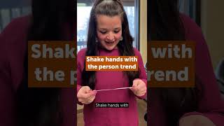 Shake hands with the person - Audio Described