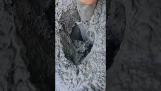 muddy rubber riding boots in wetsuit