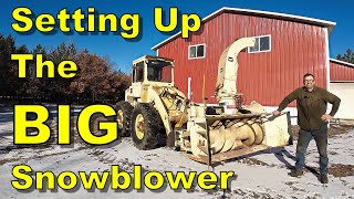 preparing to take on winter with a massive snowblower for the wheel loader.