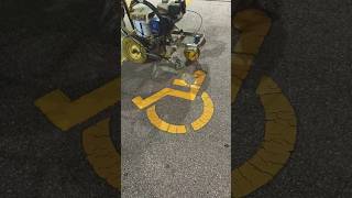 Respraying Handicap Sign by Professional with Graco LineLazer