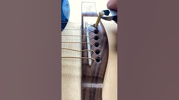 Restringing a guitar in 60 seconds
