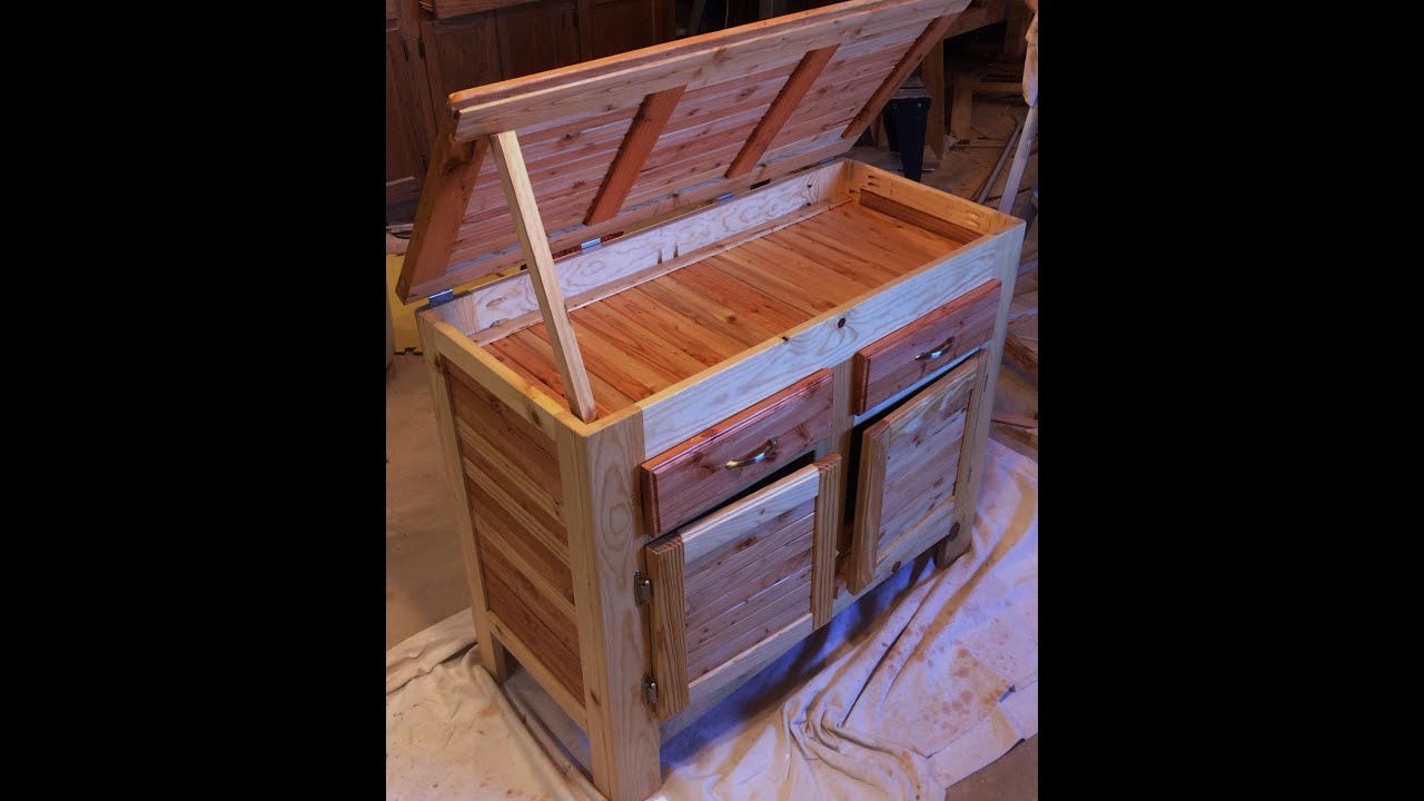 Pallet wood storage cabinet made from pallet wood cut into strips ...