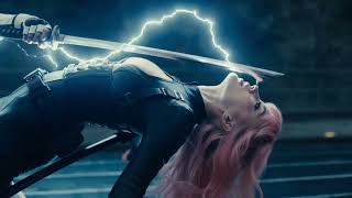 Dramatic low-angle tracking shot speeds train tracks through a narrow mountain gorge, dark, rocky