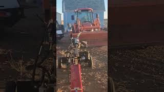 pulling log splitter ram apart with skidsteer and tractor