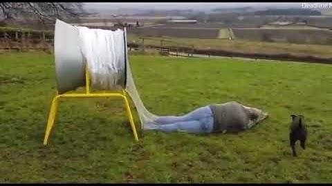 Hilarious moment woman jumps through tree netting machine
