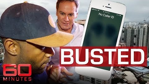 Reporter tracks down scammers in dramatic raid | 60 Minutes Australia