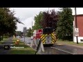 4K UHD - Firetruck driving fast with lights and sirens near camera