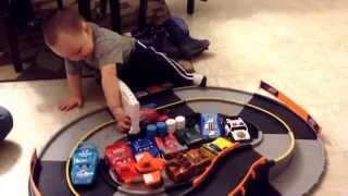 Bentley Racing His Shake N Go Cars On The Track. He Loves Em