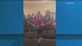 Decatur mom carried out of school board meeting after calling officials 'cowards'