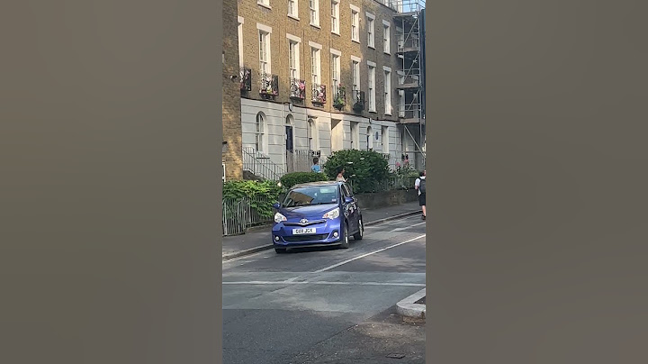 Watch angry homeowner throw buckets of water on Just Stop Oil protestors from balcony | SWNS