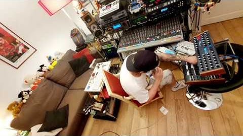 Lawron making music in his studio.