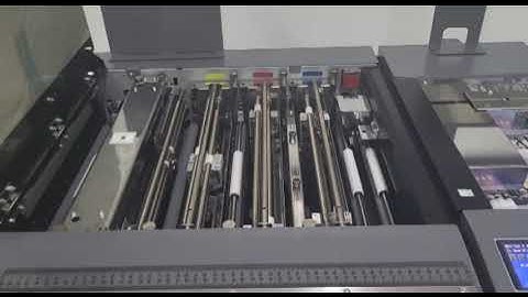 Duplo DC 618 Multifinisher (Slitter/ Cutter/ Creaser) processing SRA3 paper sheet to A6 size flyers.