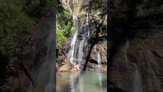 Under a waterfall eating an orange #shorts