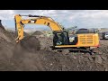 Caterpillar 352F Excavator Loading Trucks With Coal