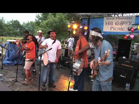 Led by Sharde Thomas on the fife, The Rising Star Fife & Drum Band performs "Shimmy She Wobble" with Ricky Davis of Blue Mother Tupelo on guitar, Cody Dickinson of the North Mississippi Allstars and Hill Country Review on drums, and Luther Dickinson of the North Mississippi Allstars and the Black Crowes on bass. This song was recorded at the 5th annualNorth Mississippi Hill Country Picnic, a two-day event which takes place in Potts Camp, MS. The North Mississippi Hill Country Picnic is hosted by Kenny Brown who played guitar with the late blues legend, RL Burnside. The event is patterned after an annual event held for decades by the late Otha Turner of Gravel Springs, MS who is Sharde Thomas' grandfather. Ms. Thomas learned to play the fife from Mr. Turner. The Otha Turner family picnic (sometimes called the Goat Roast because goat sandwiches are served) is still held in Gravel Springs, MS each year on the last weekend in August. More about Otha Turner: www.othaturner.com http More about the North Mississippi Hill Country Picnic: www.nmshillcountrypicnic.com A review of the 2010 North Mississippi Hill Country Picnic can be found here www.ameriblues.com