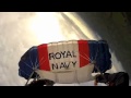 Smile that says it all...from 12,000ft! Joy of Royal Navy pilot celebrating his 1,000th parachute jump with leap over his own base