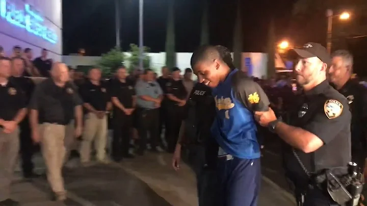 Teen accused of killing Biloxi officer escorted in...