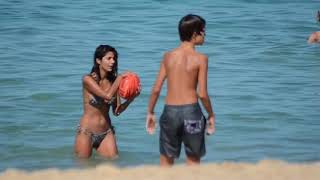 Pia miller plays afl with her 2 sons in a bikini at the beach