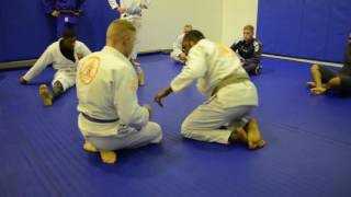 Half guard twist back sweep flow drill