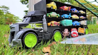 Black truck happily find cars minicars in the athletic park.