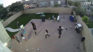 Guy throws ball that accidentally knocks over little boy (security camera)