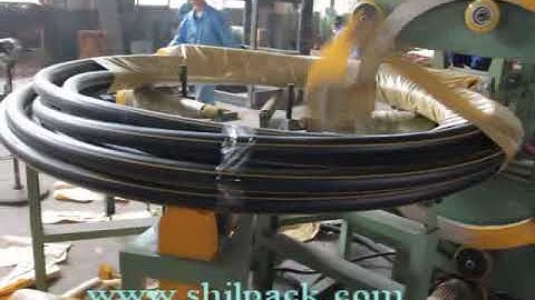 Horizontal coil wrapping machine