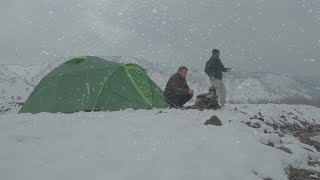 Enjoying camping under snowfall