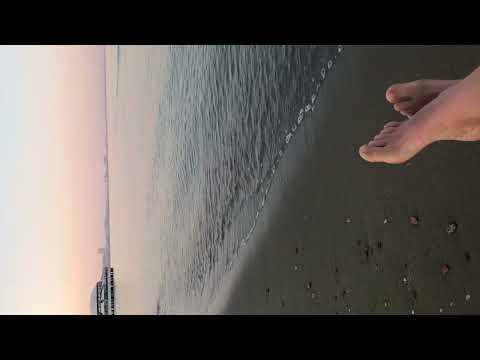 barefoot on the seashore listening to the sound of the sea