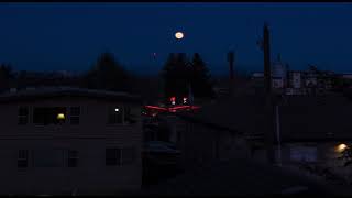 Photographer uses a deck and a ladder to film super-moon over Seattle