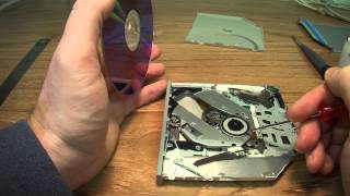 how to remove a cd rom disk that is stuck in a slot loading apple's imac or macbook computers