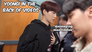 yoongi in the back of videos