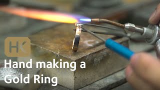 Hand making a Gold ring