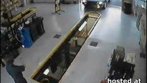 Car drives in service pit