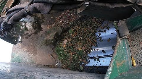 Amrep Automated Side Loader on Heavy Greenwaste. Hopper Video!