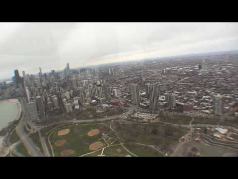 Helicopter flight over downtown Chicago (HD)