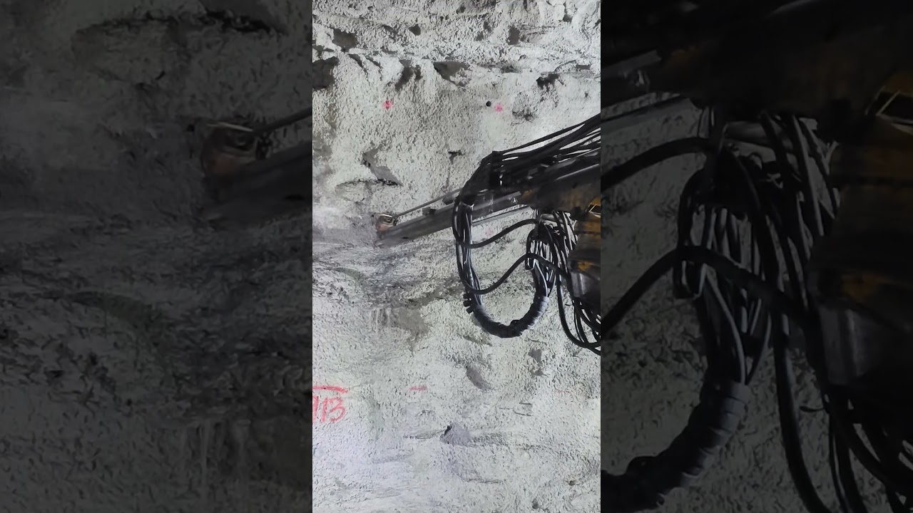 Rock bolting in progress: Active reinforcement for rock mass stabilization and tunnel safety.