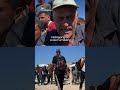 Starving Palestinians carry bags of flour in northern Gaza
