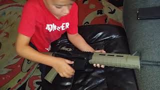 Gyven taking apart an AR-15...his first try. Nailed it!